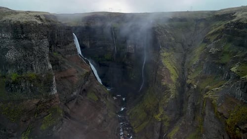 Majestic Waterfall Cascading Down Rugged Cliffs in the Dramatic Landscapes of Haifoss Iceland
