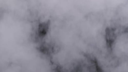 Real Explosion Vapor or Smoke Clouds Rise Up on Black Background in Slow Motion