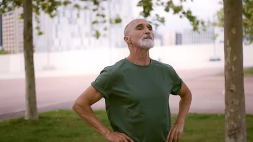 Senior Man Resting After Exercise in Urban Park