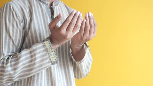 Muslim Man Keep Hand in Praying Gestures During Ramadan Close Up