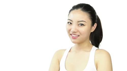 Attractive woman from east asia in her 20s isolated in studio