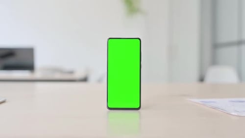 Green Screen Smartphone on Desk in Office