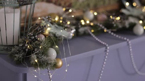 Decorated Holiday Mantelpiece with Ornaments and Lights