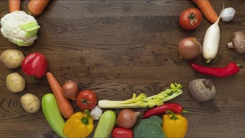Various Fresh Vegetables Arranged on Dark Wood Surface