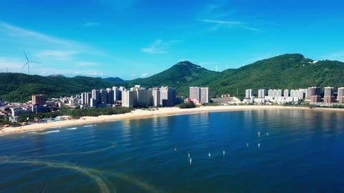 Aerial Top view of a transparent blue sea with beautiful waves at sunny day in summer. air of ocean