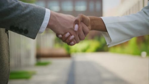 Business People Handshake in Urban Setting