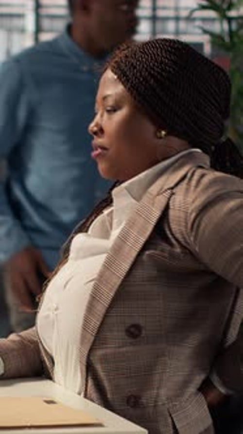 Vertical Video Woman CEO Suffers From Muscle Cramps Due to Incorrect Posture at the Desk