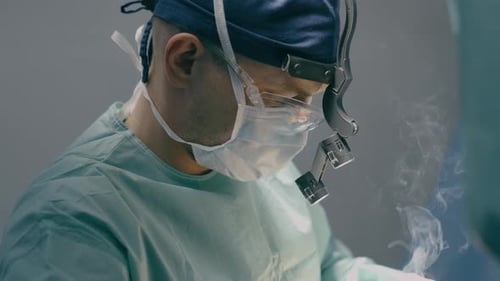 Close Up Doctor Man Physician Practitioner Surgeon Medic in Protective Medical Mask Perform Surgical