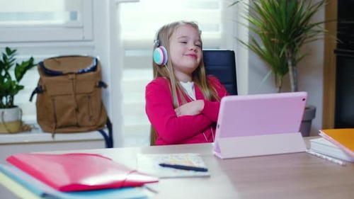 Happy Young Girl Using Tablet with Headphones
