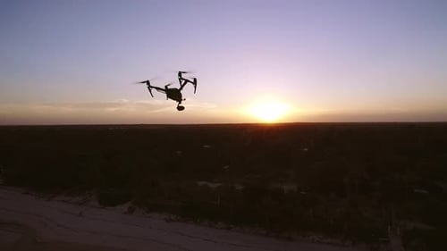 Aerial Drone Quad Copter Footage Flying Over Tropical Area And Towards The Sun.