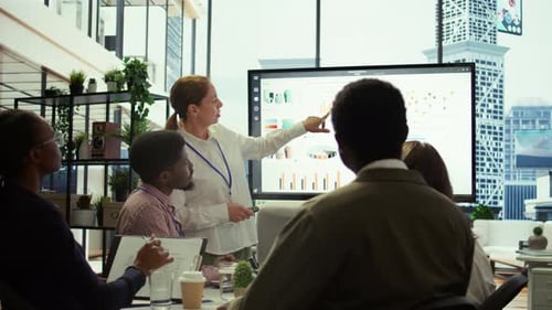 Business Team Meeting Presentation in Modern Office