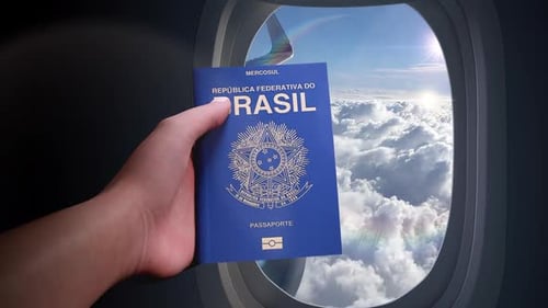 Brazilian Passport Held in Airplane Window During Travel