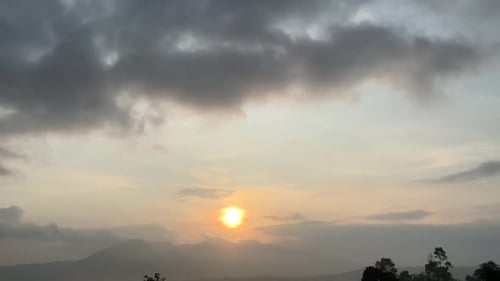 sunrise on forested mountains