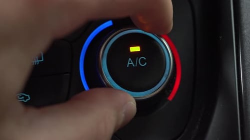 Turning on car climate control button in automatic mode of temperature control in cabin