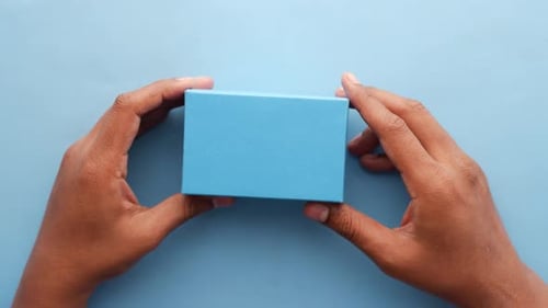 Top View of Person Open a Empty Small Gift Box