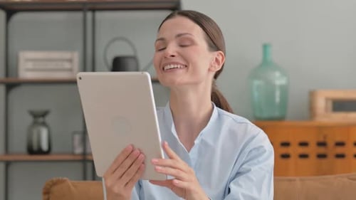 Woman on Tablet Having a Video Call at Home