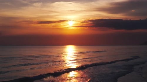 Sunset Reflections Over the Ocean Waves