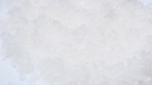 Close Up of Rotating Rock Salt Cooking Concept Table Salt