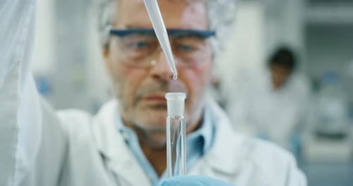 Scientist Uses Pipette with Test Tube in Lab