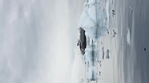 Large Cruise Ship in the Bay Near the Antarctic a Huge Iceberg on Mountains the Southern Ocean of