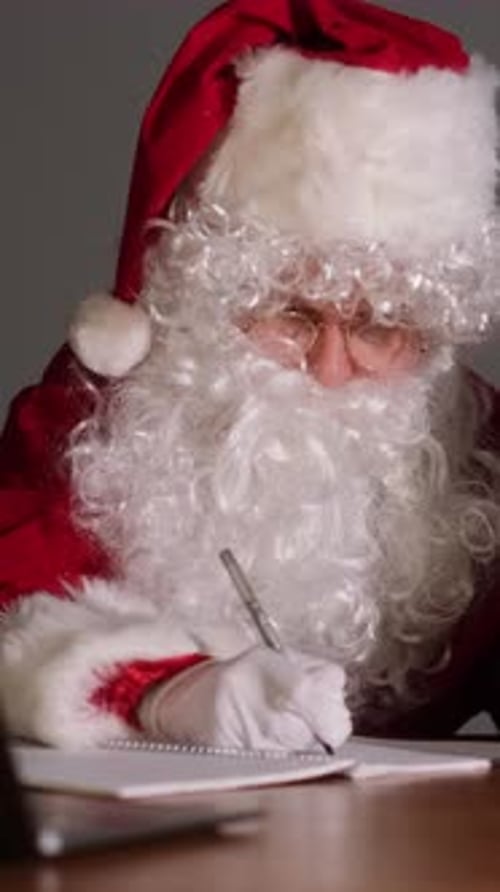 Santa Claus Writing His Naughty or Nice List