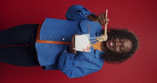Woman Eats Noodles With Chopsticks