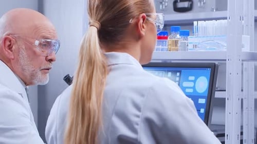 Scientists Analyzing Data in Modern Lab Setting