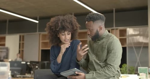 Business people casual meeting in office, discussing plans on Digital tablet