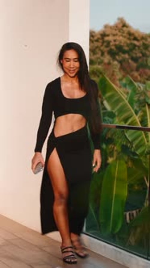 Glamorous Woman Posing in Fashionable Black Outfit