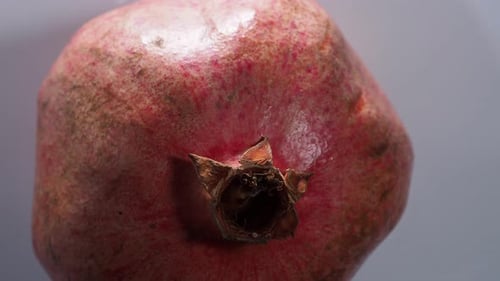 Bright red fresh pomegranate. Rotating red ripe pomegranate. High quality 4k footage