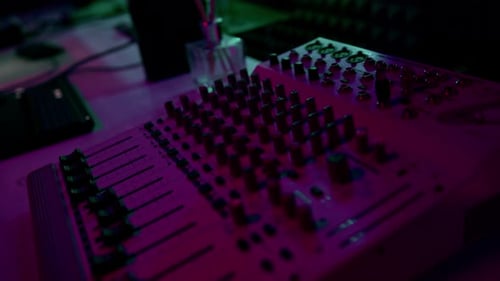 professional sound recording studio sound engineer or music producer sitting at the remote control