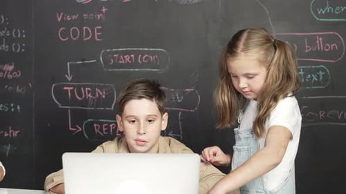 Boy using laptop programing engineering code and writing program. Erudition.