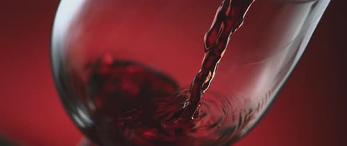 Pouring Red Wine from Bottle