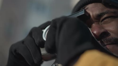 Man Using Vintage Camera Taking Photograph Outdoors