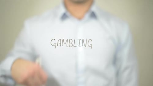 Man Writing Gambling on Clear Surface