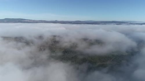 Flying in Sunrise Clouds The Clouds are Moving on Camera Aerial Drone View