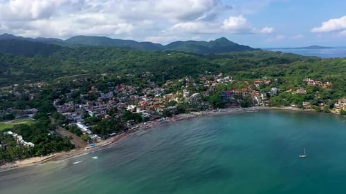 Aerial View of Tropical Coastal Town and Beach