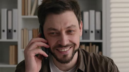 Man Talking on Phone Indoors Close Up