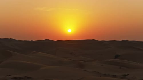 Aerial View of Golden Sunset in Dubai Desert Landscape