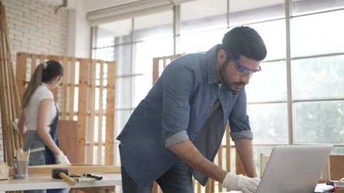 Man and Woman Work in Woodworking Shop