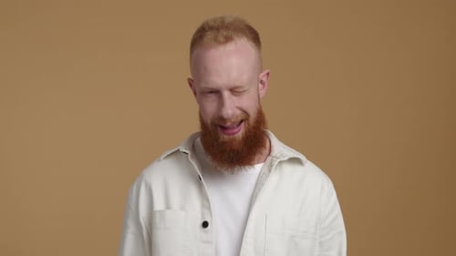 Portrait of a Cheerful Joyful Guy in His 30s with a Positive Facial Expression