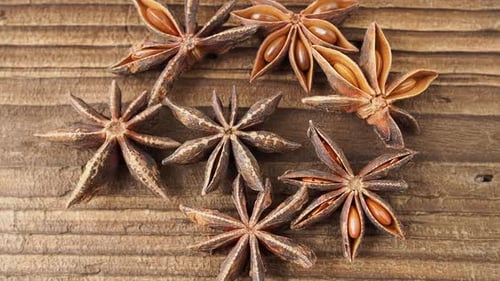 Star Anise Spice on Rustic Wooden Surface