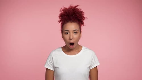 Surprised Woman with Red Hair Expressing Amazement