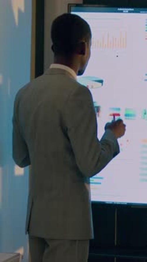 Vertical Video Employees Working on Business Charts