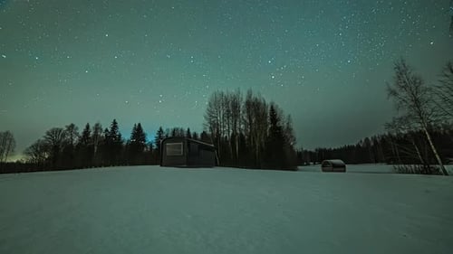 Snowy Cabin Under a Starry Night Sky