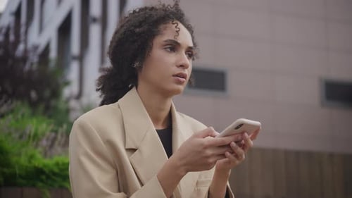 Woman Using Smartphone in the City