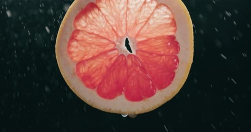 Close Up of Half Grapefruit with Water Droplets