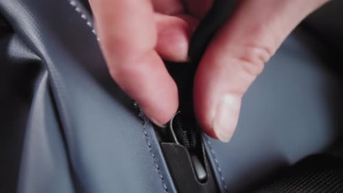 Closeup of Travel Backpack Hands Close Suitcase Person Check Quality of Goods Macro Shot of