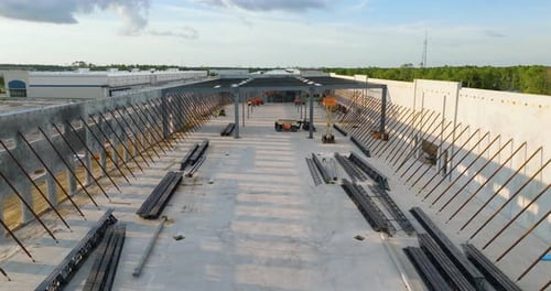 Construction Site of Logistic Center with Assembling of Concrete and Metal Frame Walls Aerial View