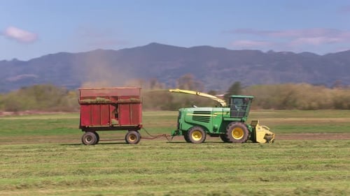 Oregon Circa-2020. Stabilized Driving Shot Of Tractor In Field. Shot With Cineflex Gimbal And Red...